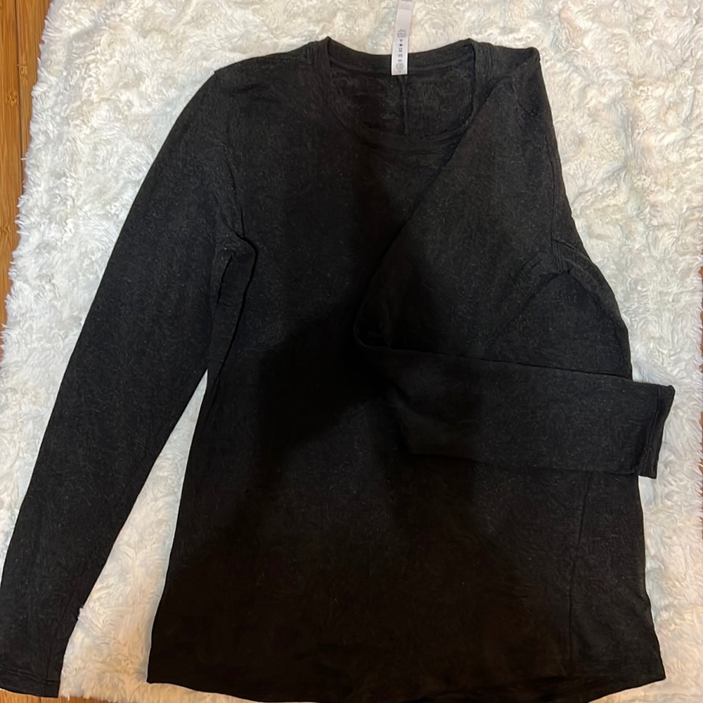 Dark charcoal grey long sleeve lululemon shirt.
